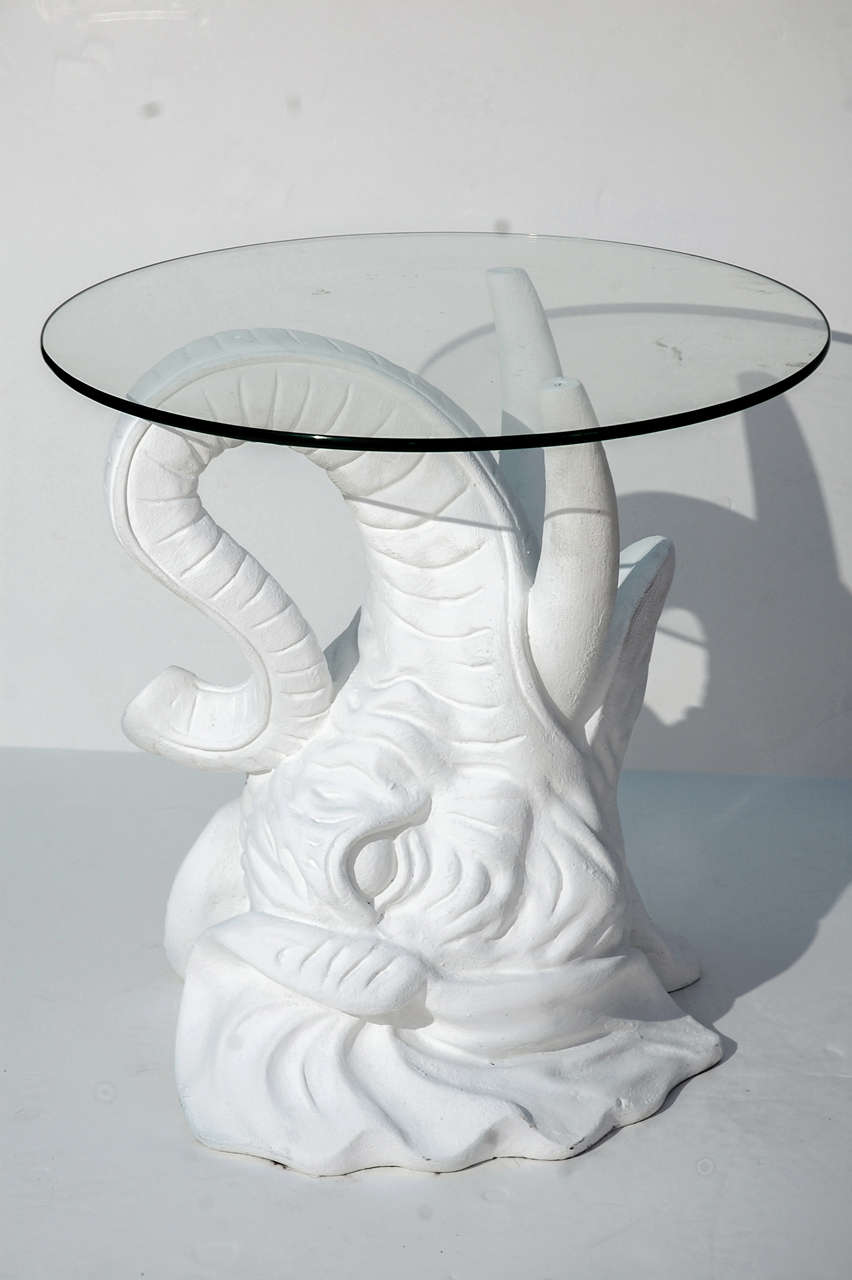 White plaster elephant head side table with round glass top