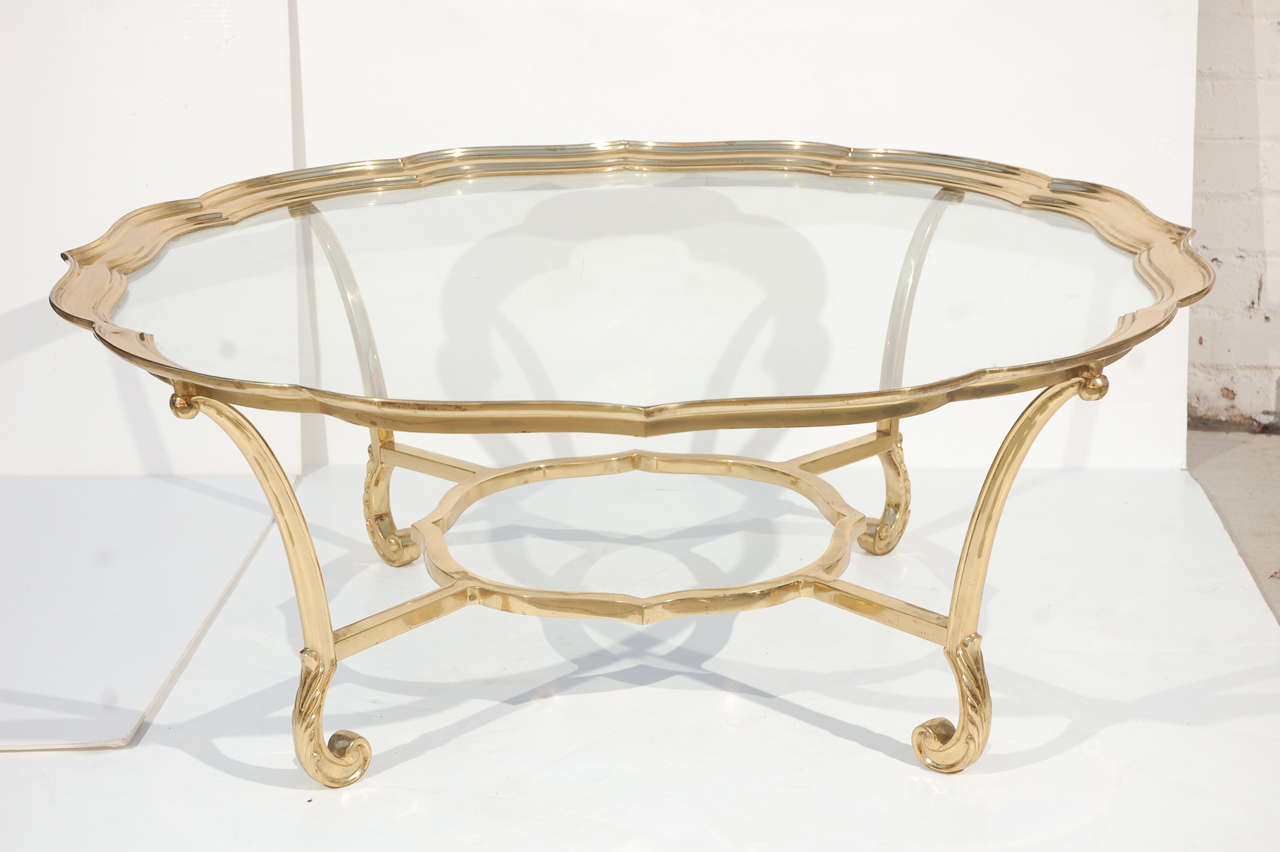 Brass & Glass La Barge coffee table with scalloped border and carved legs