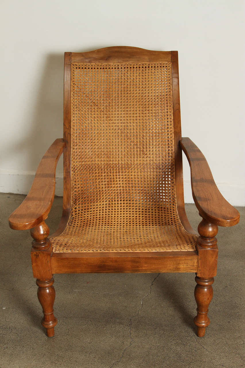 Colonial Anglo-Indian plantation chair with turned wood legs and ottoman.
Double Caned in original condition.
Chair is 32