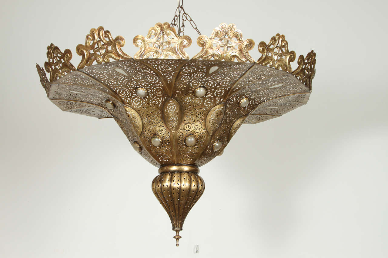 Moroccan Moorish style Brass chandelier in Alberto Pinto style .  Made of brass with some hand-blown decorative milky glass.
 Size: 33