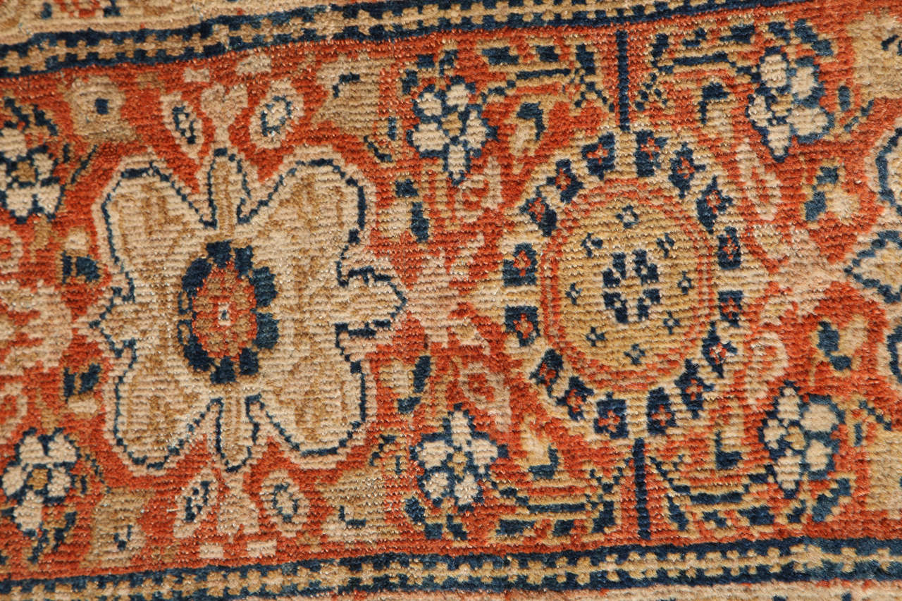 This Persian Sultanabad carpet circa 1880 consists of handspun wool and natural vegetal dyes. Created in the Sultanabad workshop of the Swiss artist Zigler, it is an extremely fine piece in exceptional antique condition, with blue and gold
