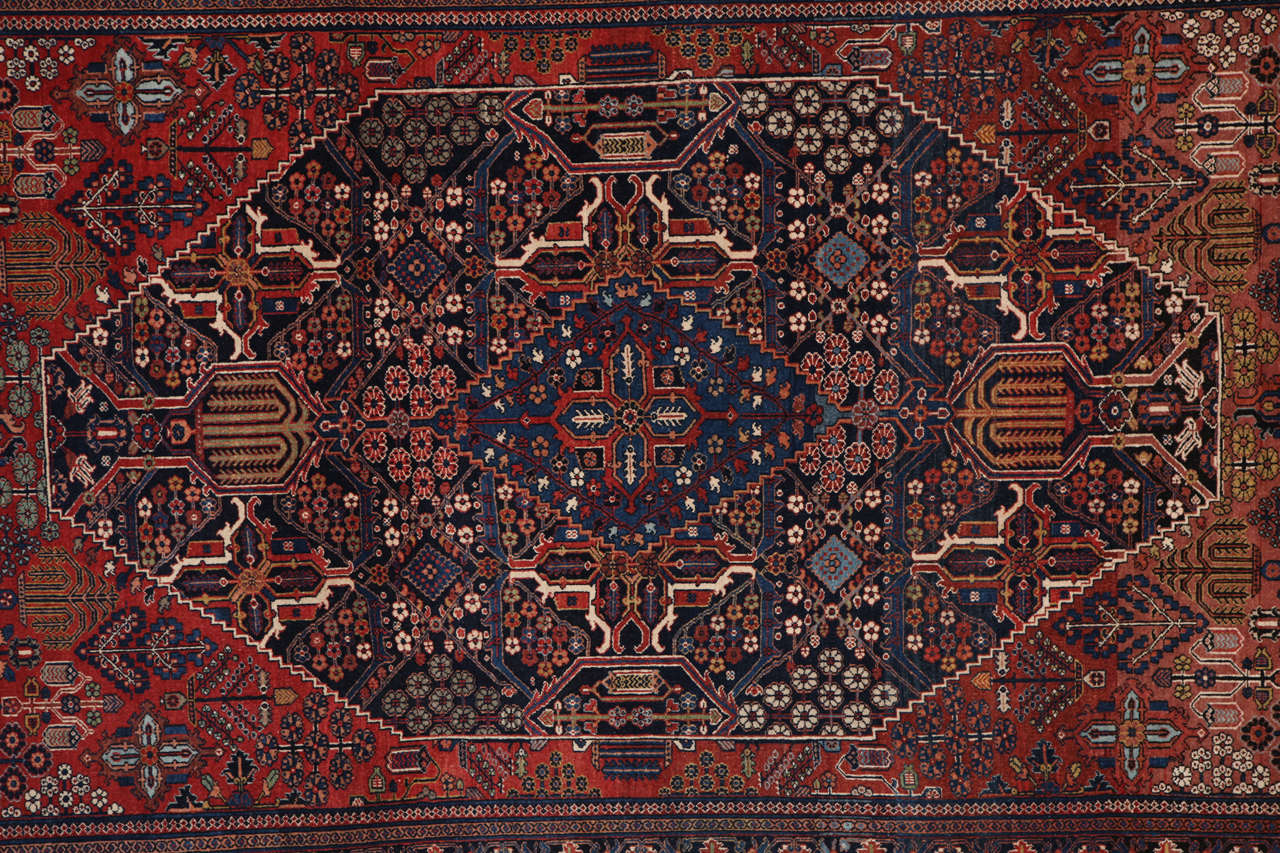 This Persian Joshagan Khosroabad carpet, circa 1900 consists of handspun wool and vegetal dyes. It is in excellent antique condition, and the size is 7'8