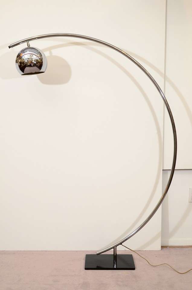 A vintage chrome arched floor lamp with globe-form chrome shade and black enameled cast iron base.

Reduced from $1400.00