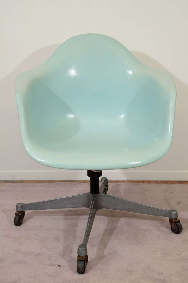 A vintage Dash 99 shell swivel chair by Charles and Ray Eames with blue fiberglass seat. Original parts with wear commensurate with age and use.

Price reduced from $1250.00