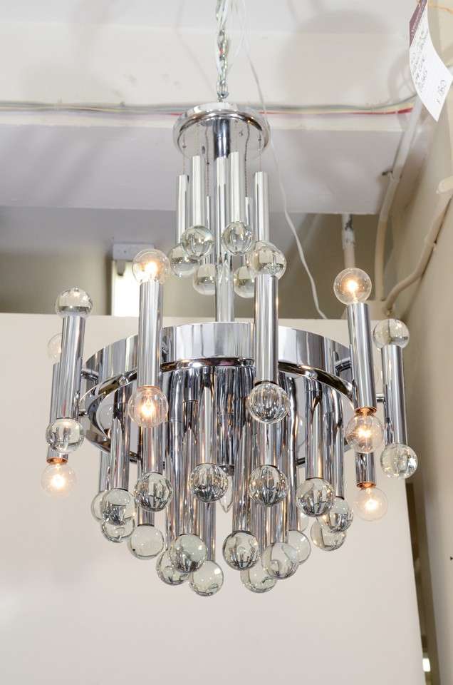 A vintage Italian chandelier by Sciolari, the modernistic chrome frame accented with clear Murano glass globes. Very good condition, consistent with age and use.