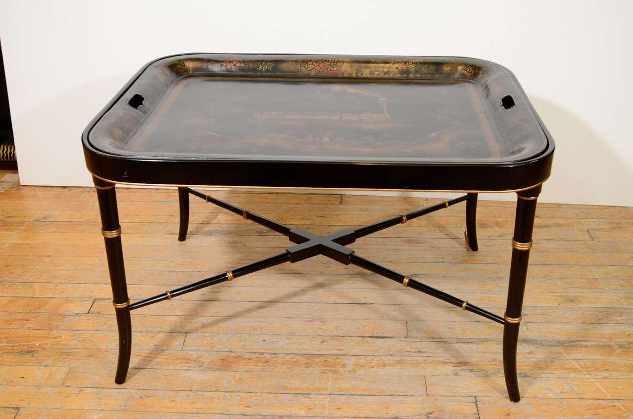 A vintage cocktail table with removable painted tray and ebonized metal faux-bamboo base.

Reduced from $1800.00