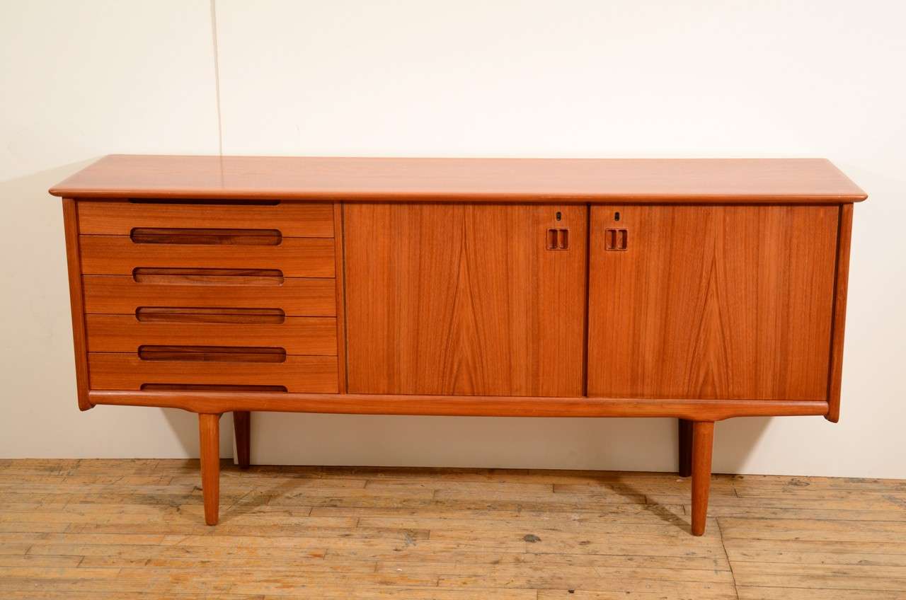 Scandinavian sideboard with five drawers and a cabinet storage area. The piece is by Arnt Sorheim and was made in Norway; stamped with maker's mark on the back.

Price reduced from $2800.00
