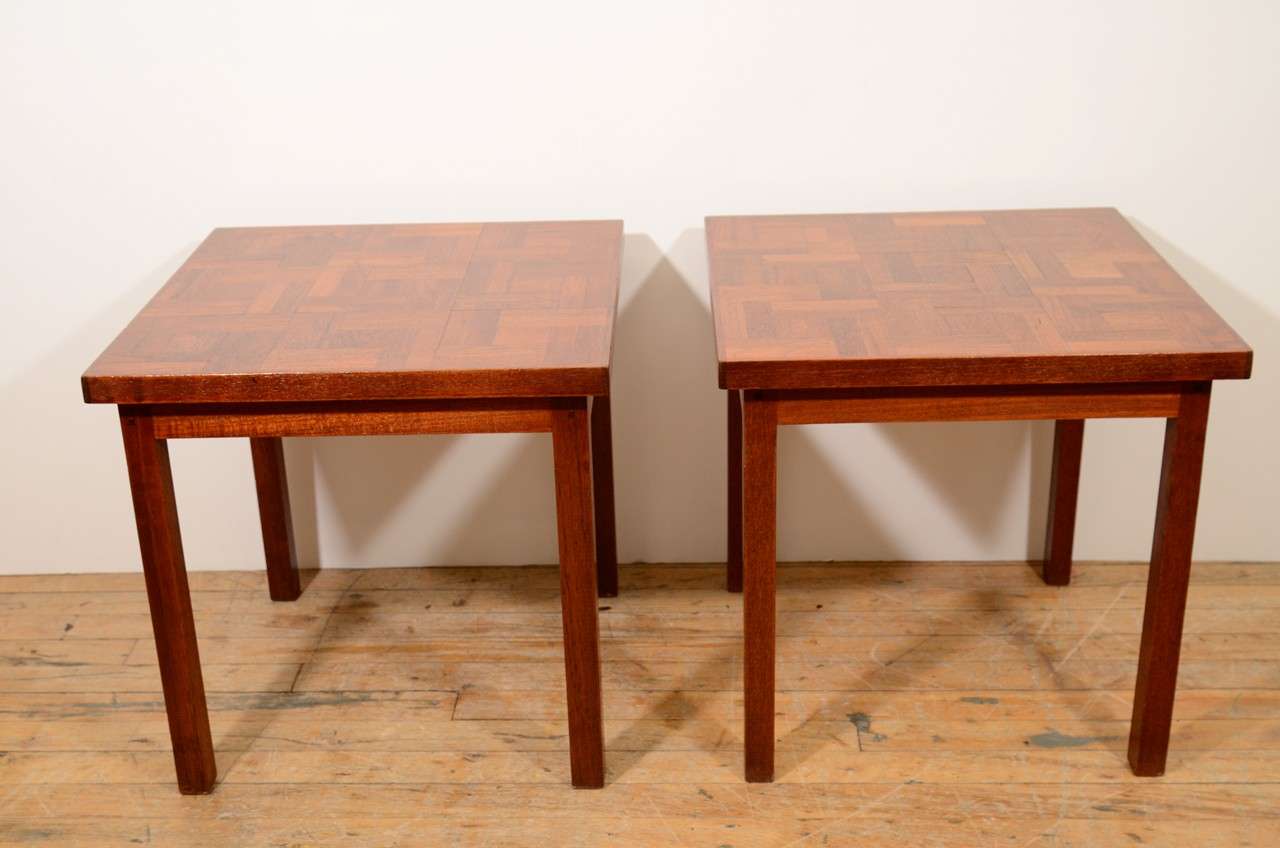 A pair of vintage side tables, produced circa 1960s, on wood frame with tile patterned wood surface. Markings include hand-written signature, dated 1967 beneath the table top. Very good condition, with age appropriate wear. 