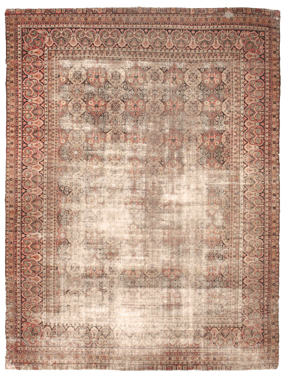  A rich, bold palette would seem appropriate for this very large Amritsa Antique Indian Rug of regal color and appearance. Brown, rust orange and parchment predominate. A border of large segmented rosettes and smaller spreading palm fronds encloses