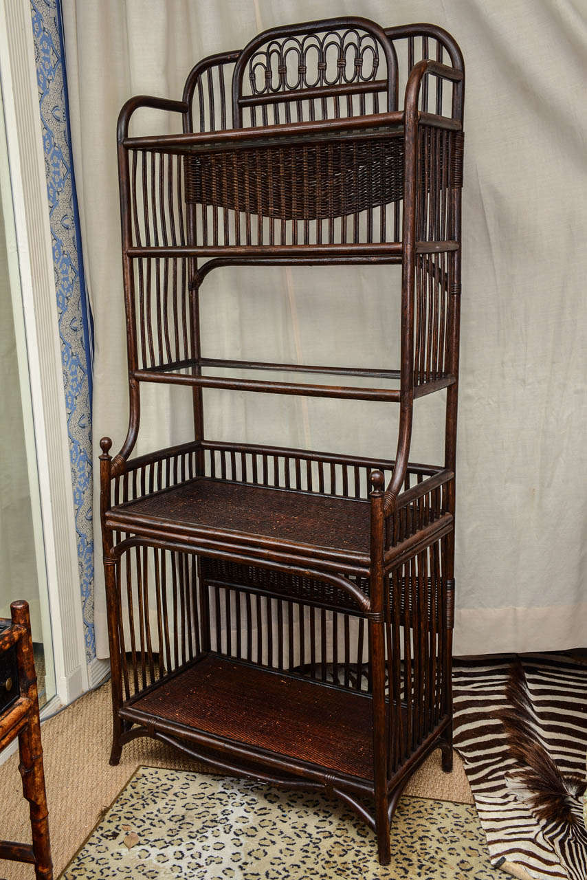 Bamboo and Rattan Bakers Rack  with glass shelving. Very charming and useful.
Could be painted.