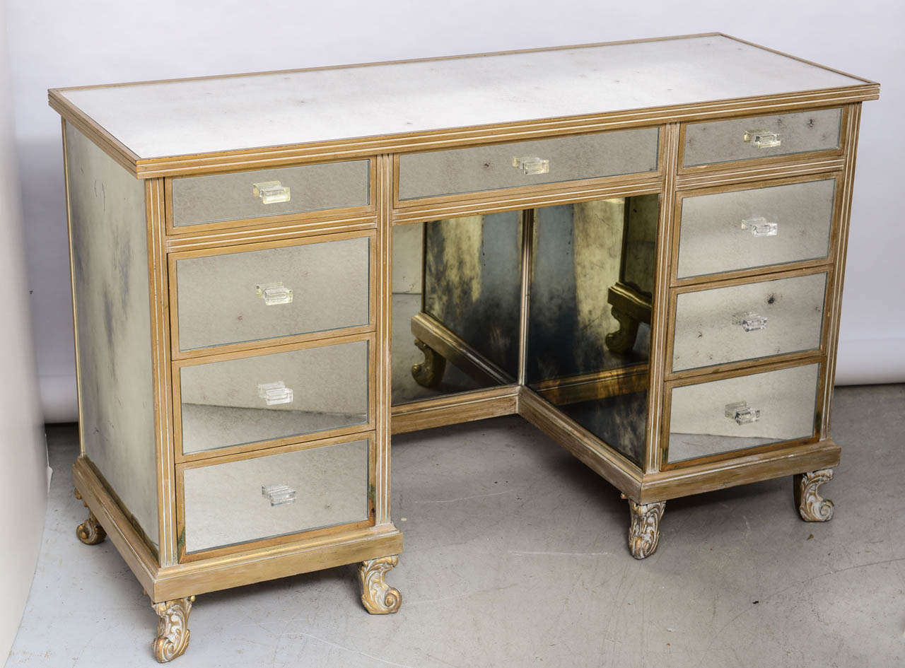 Very Functional Mirrored Desk/ Vanity Fitted with 4 Drawers on each Side
and a Center Drawer.
Each Drawers have a Lucite Knob applyed and Water Guild on the Wood Trim.
The Knee Hole Section Measure : 25