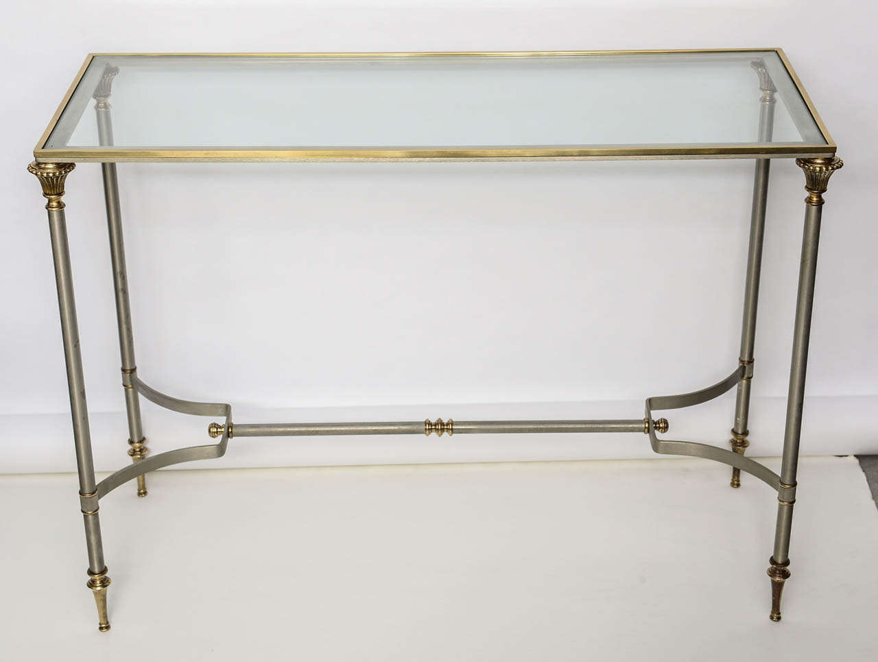 Stunning steel and brass console with glass top.
