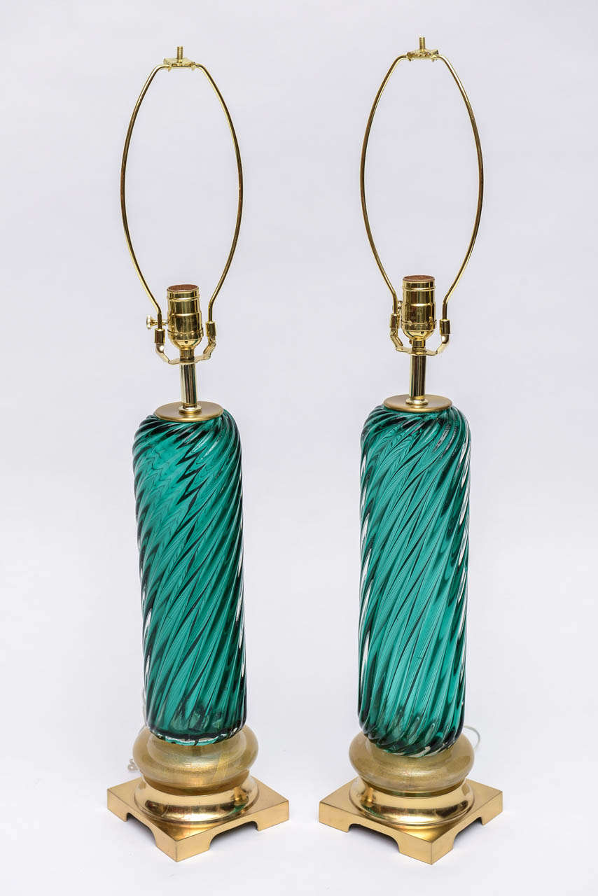 Handsome pair of two toned green and gold fleck Murano lamps on brass bases.