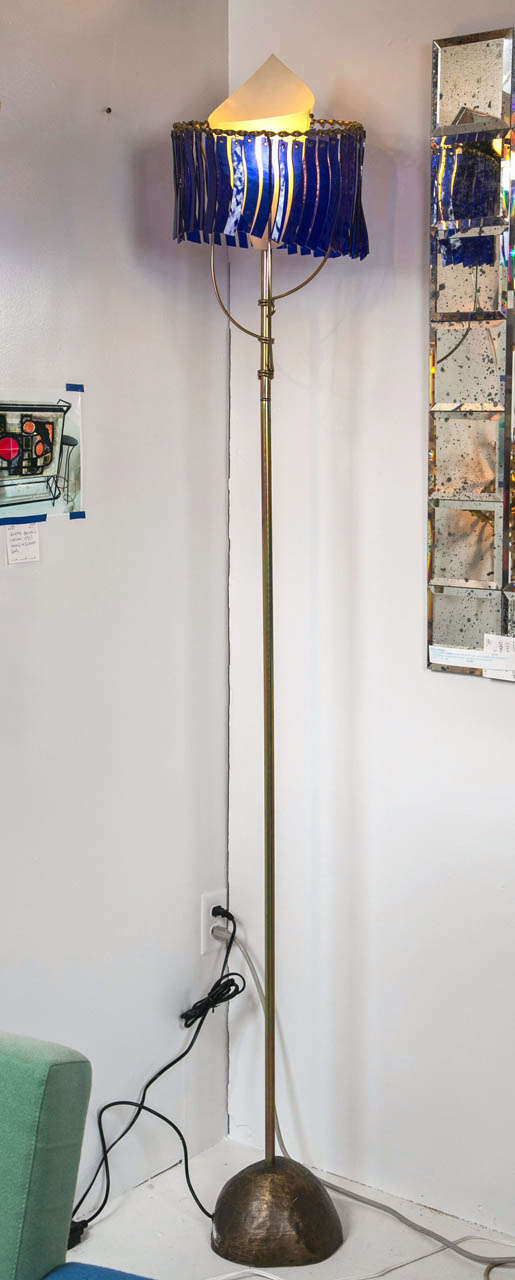 Artemide Floor Lamp - Toni Cordero's design -Turin for Della Rocca. labeled on base. Galvanized steel structure with cast brass base finished in bronze. Diffuser constructed of stips of blue cathedral glass.