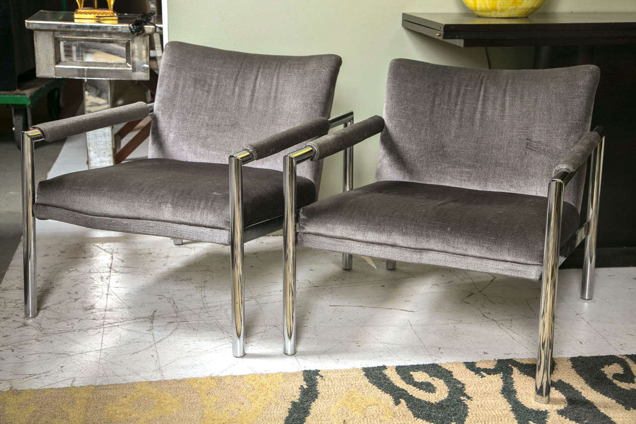 A fabulous pair of mid century modern arm chairs attributed to Milo Baughman, newly upholstered in grey velvet.