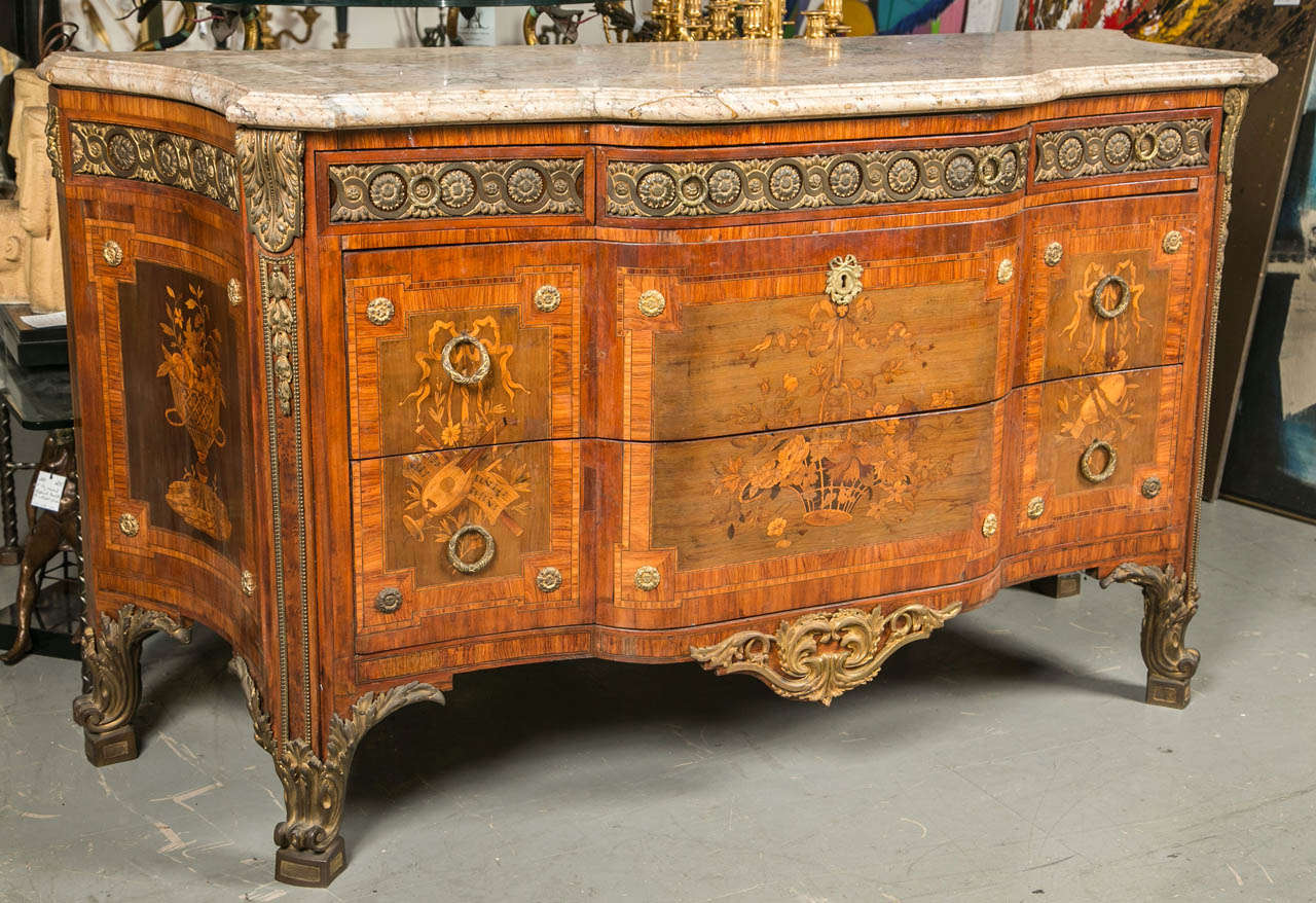 A circa 1800 museum quality French commode with Dore bronze mounts.