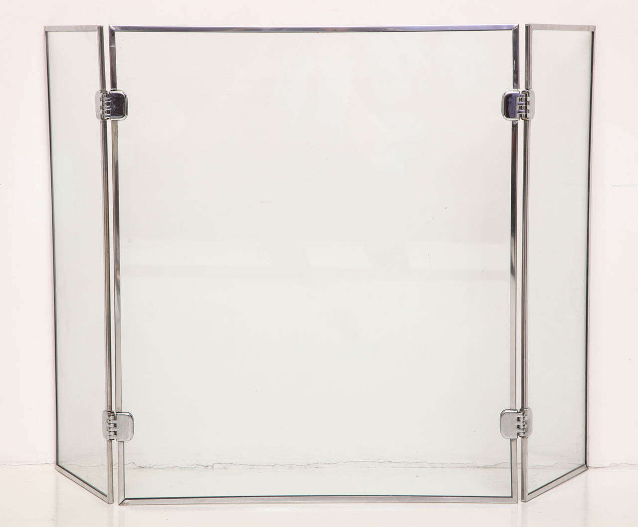 KARL SPRINGER (1930-1991)
Folding screen in tempered glass with chrome frame and hinges
American, c. 1970

Screen: 26.5”H x 45”W (unfolded) x .5”D