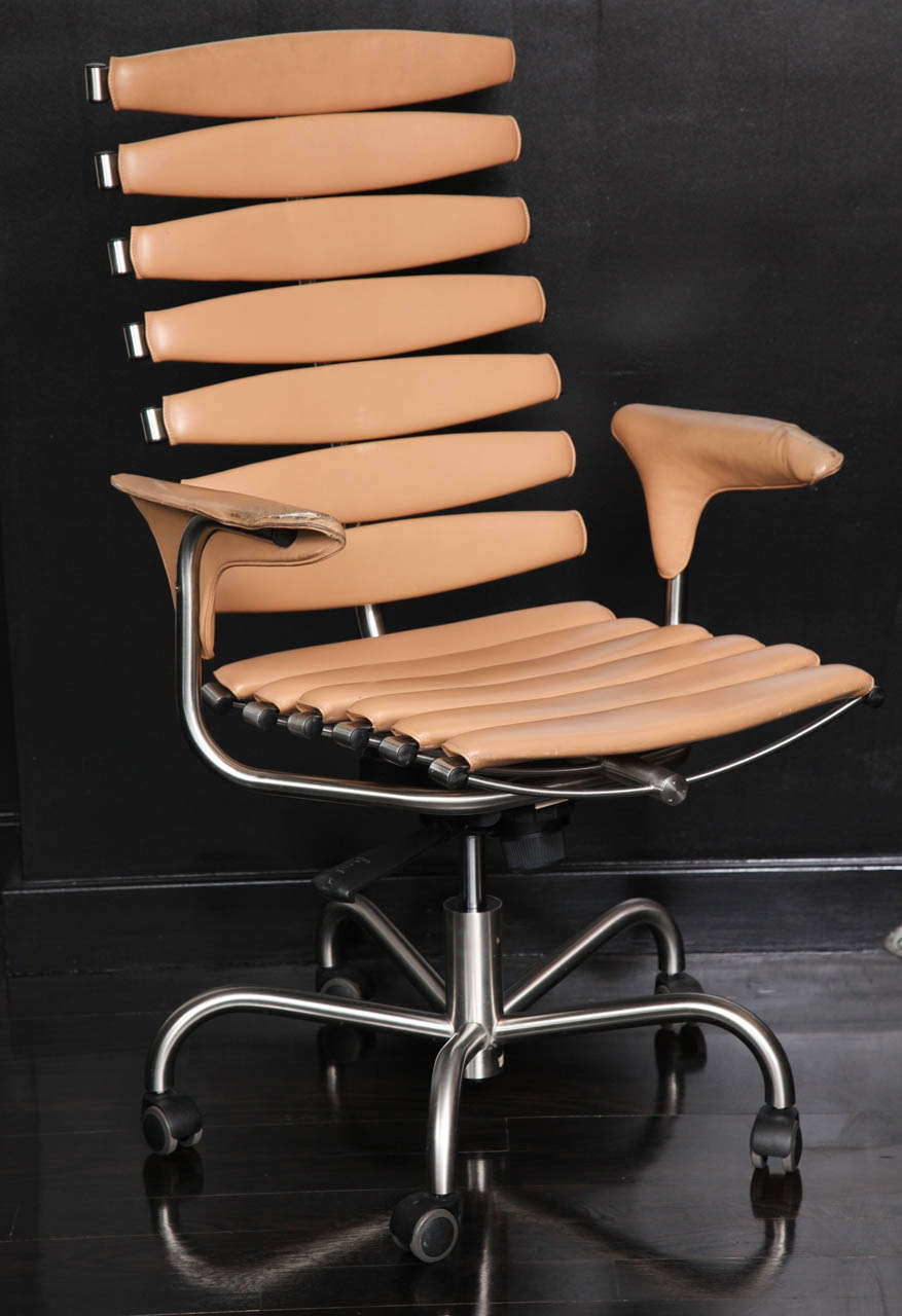 Great form and construction give this office chair a distinctive look. Upholstered in leather.