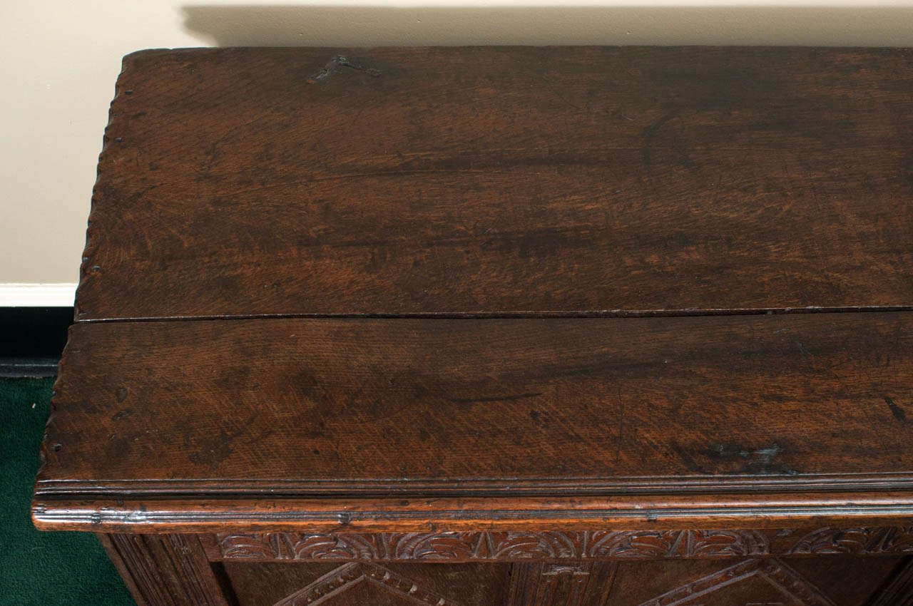 The patina on this piece is amazing!  We have carefully cleaned and waxed this 17th century coffer, giving a rich glow to the beautiful old English oak. Excellent carving including the initials 