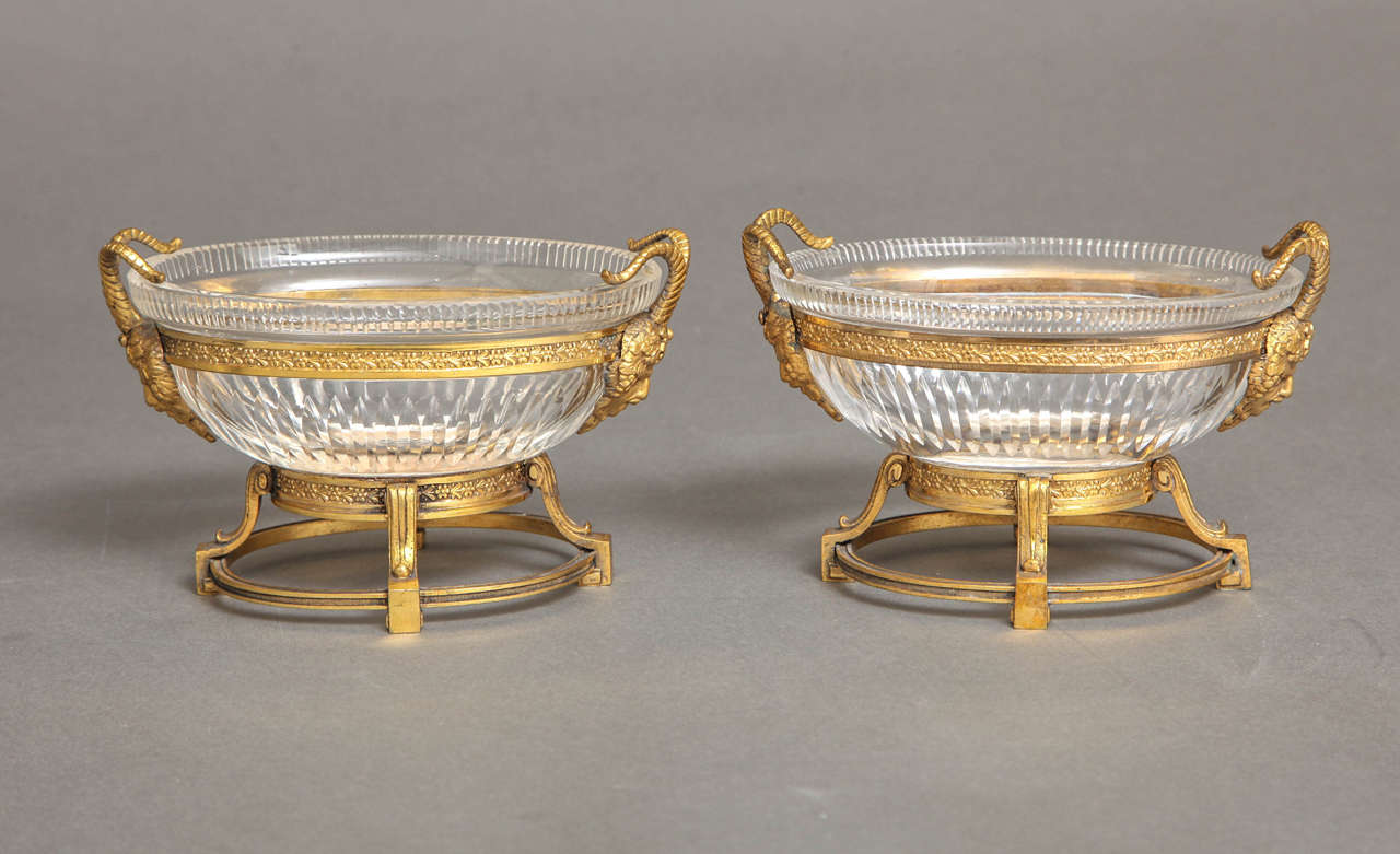A beautiful pair of hand diamond cut Russian crystal and doré bronze mounted oval shaped centerpieces in the Louis XVI style, attributed to the Imperial Russian Glass Manufactory, early 1800s. Each beautiful hand diamond cut crystal bowl mounted in