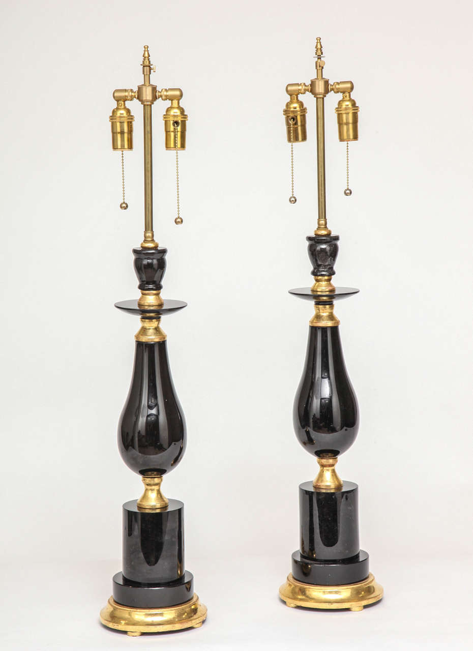 A fine pair of modern black Russian obsidian and giltwood lamps, 20th century.

Height with electrical fittings is 34.5 in. Height without electrical fittings is 23 in.