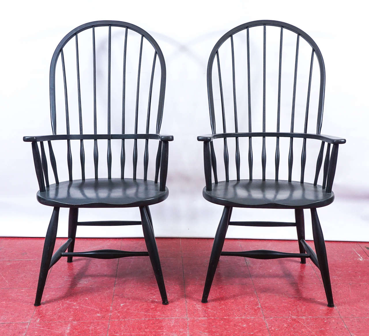 These sack back Windsor armchairs are tightly constructed with double stretchers and secured arms and backs.

Measure: Arm height: 26.75