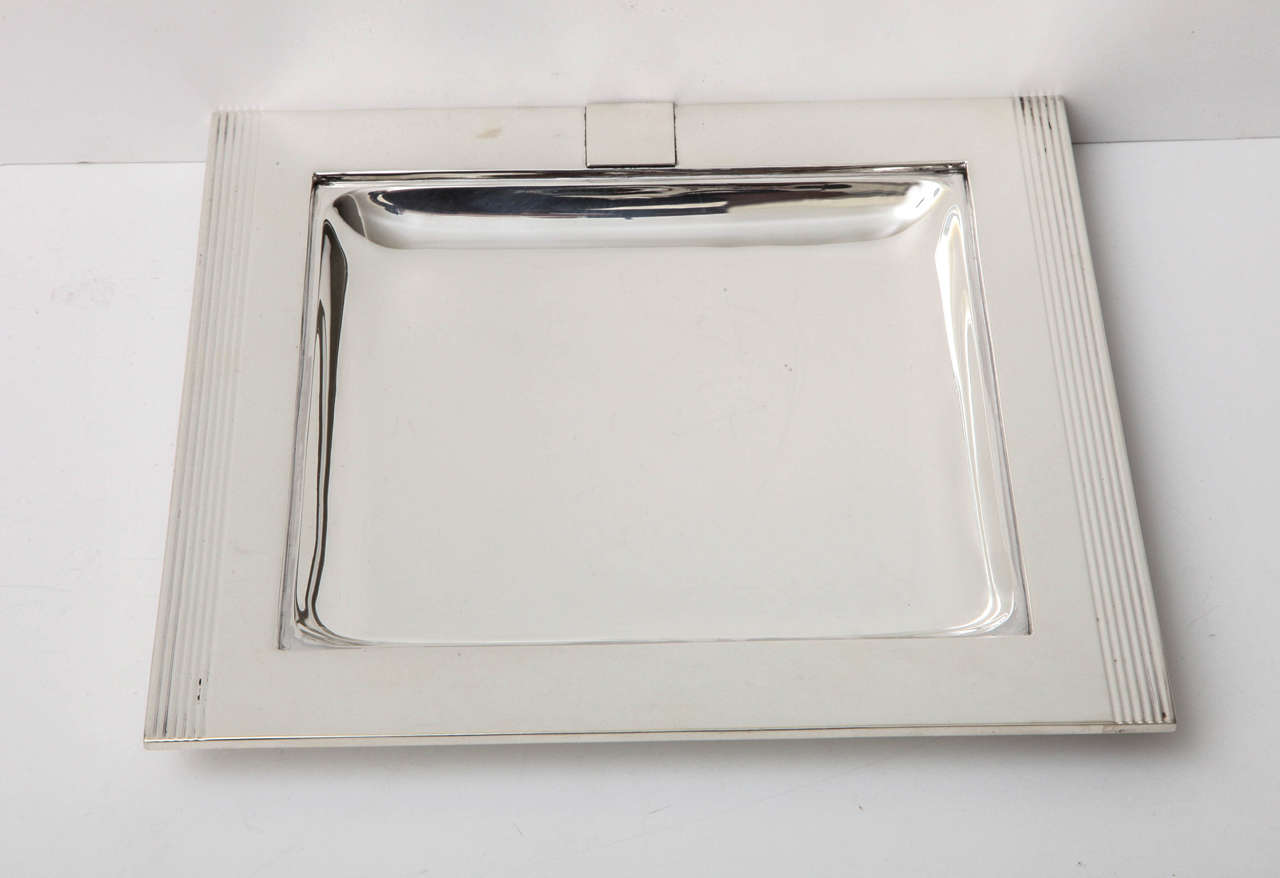 A stunning and exceptional quality sterling silver catchall. The piece is a great size to sit by door to empty keys and loose change, or on a dresser to keep all cufflinks, watches and accoutrements. It also has a cartouche that has yet to be