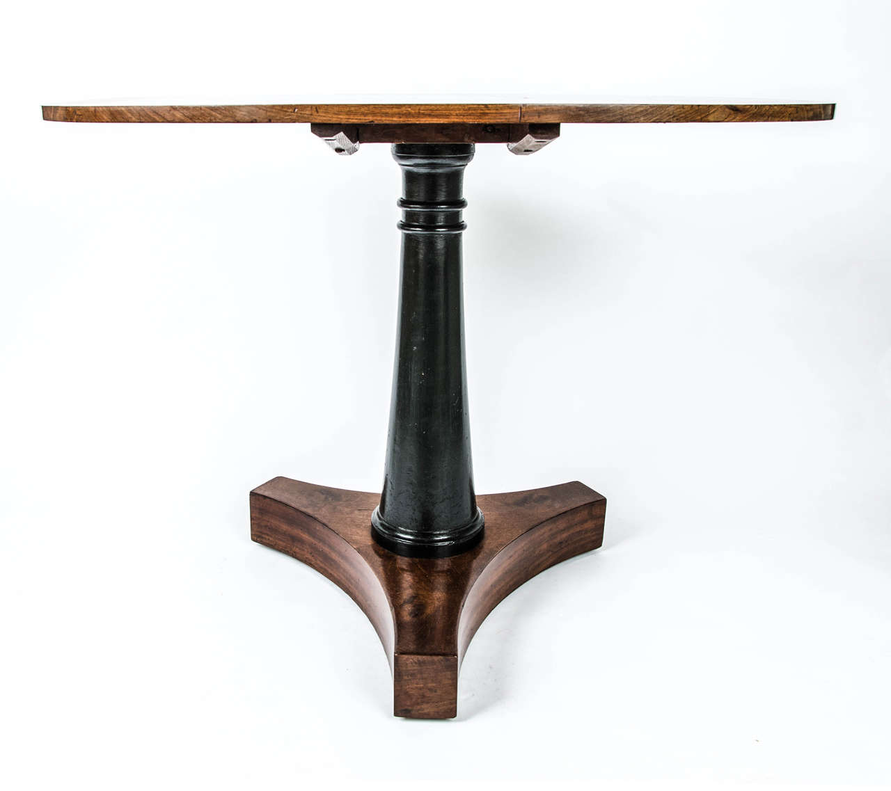 An early 19th century Regence mahogany and ebonised centre table.