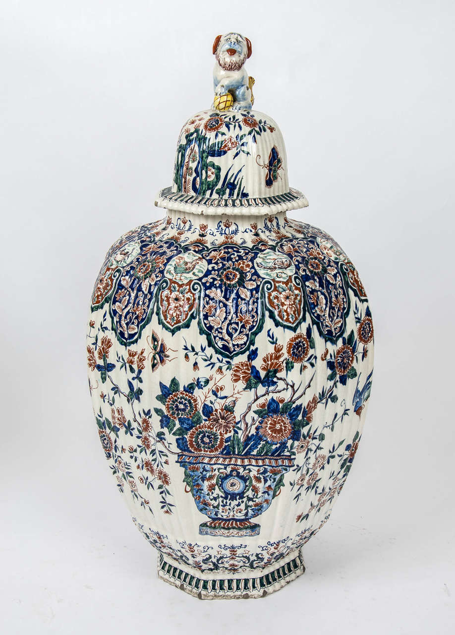 Dutch A massive garniture of 19th century Delf vases.