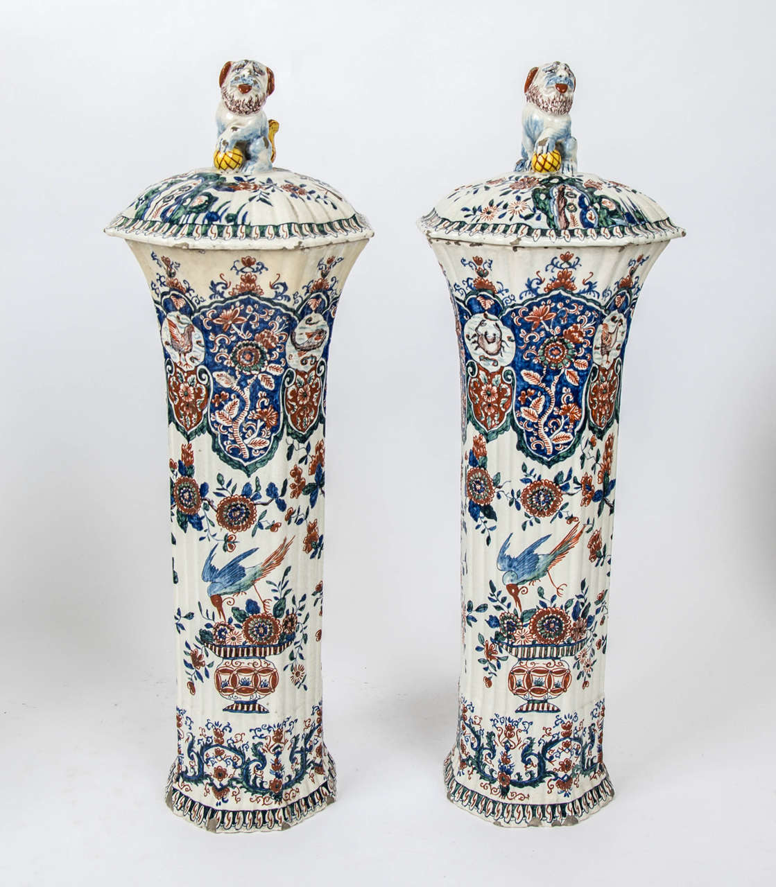 A massive garniture of 19th century Delf vases. 2