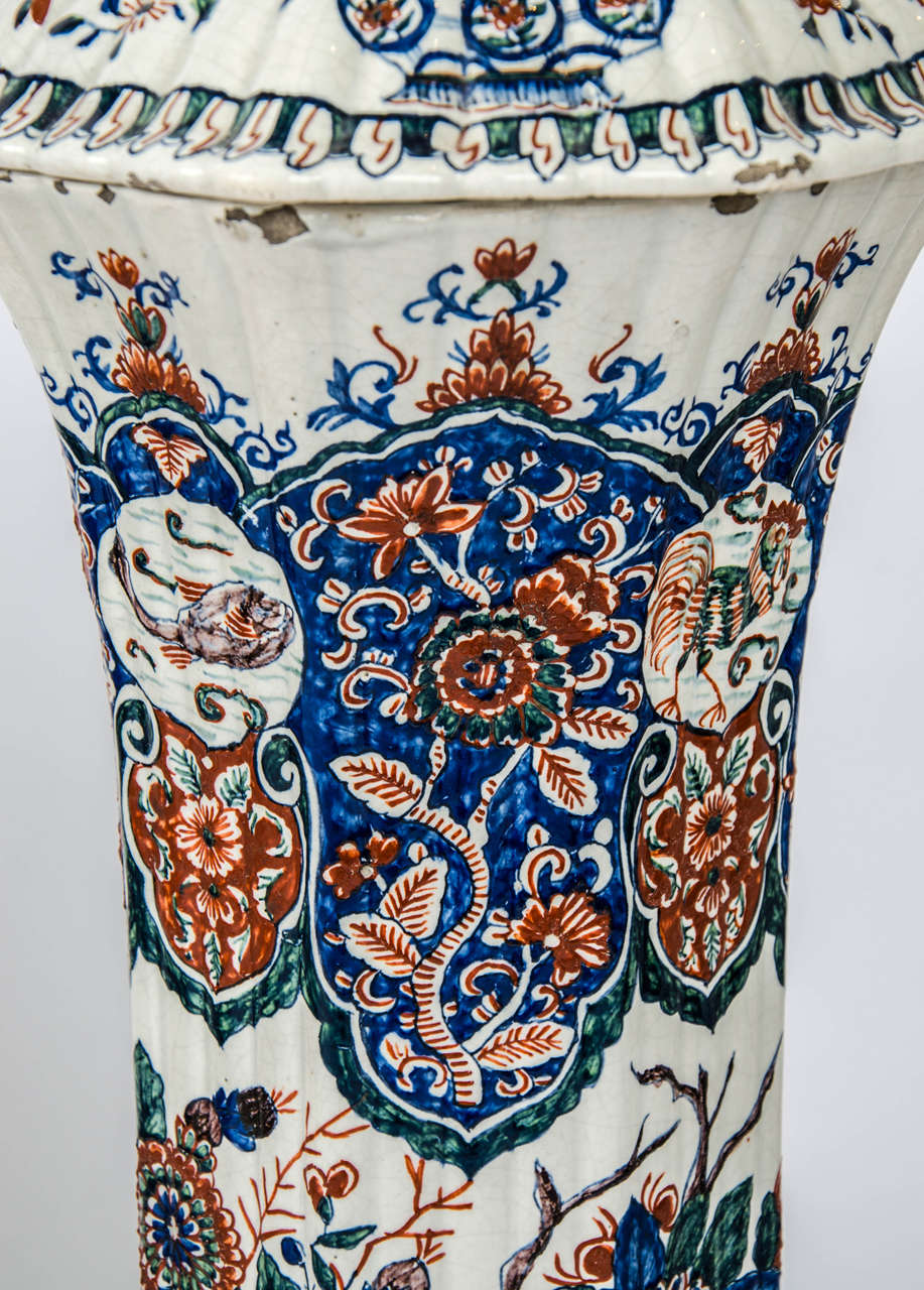 A massive garniture of 19th century Delf vases. 5