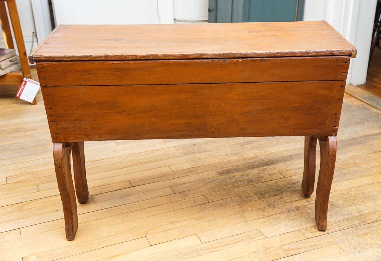Here is a wonderful little treasure! A sweet Canadian dough rising table. It is the ideal side table, sofa table or nightstand. The curved legs and terrific patina are just terrific. Hurry, this find will be gone very fast.