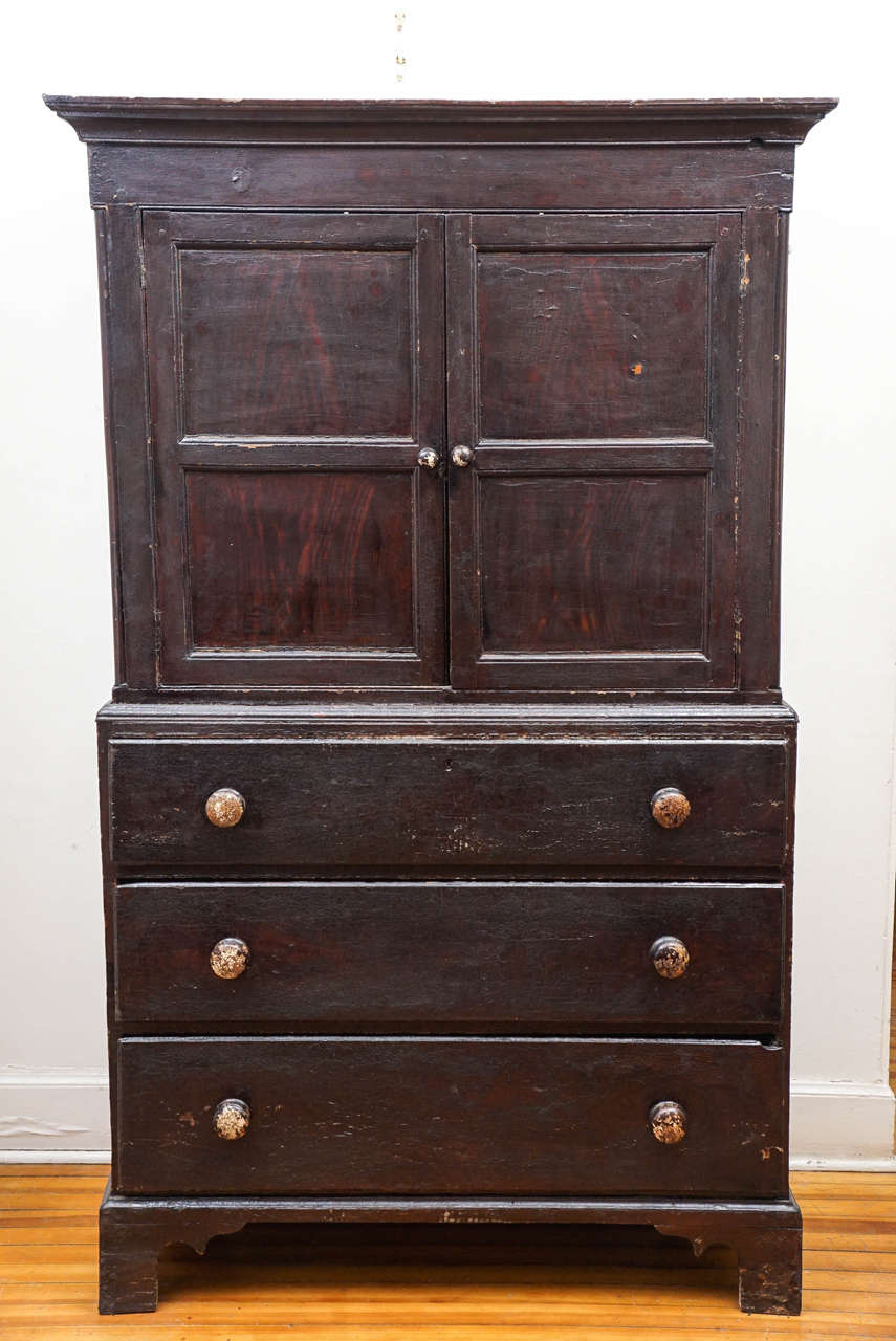 This absolutely original Welsh cupboard is a fabulous find. The two panelled doors open to a divided cupboard, perfect for storage or a flat screen television. The three large drawers below are wonderful for clothing or linens. This piece is clean