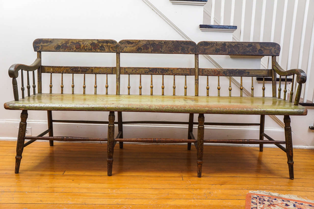There is no bench in the past five years that we love as much as this original painted Pa. Bench, which has a one-piece wood seat, that was used as a bed back in the early 1800s. The soft moss green worn color is simply spectacular! On the back of