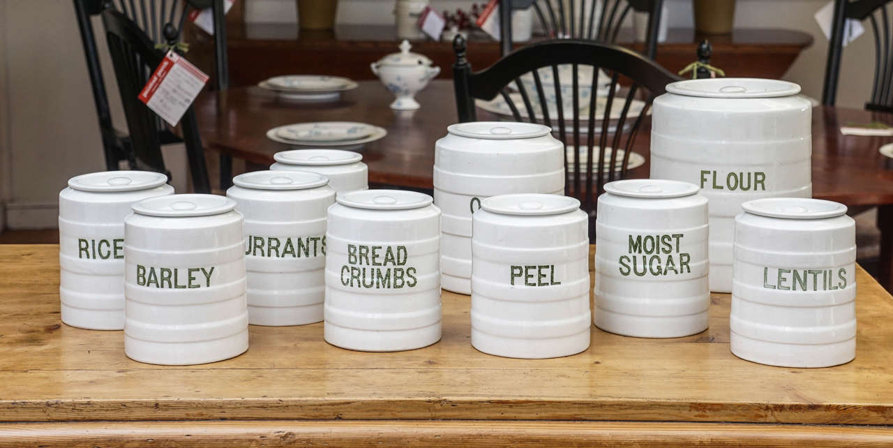 The maker is Grimwade and dates circa 1910 with original writing on each jar. All have their lids. It is rare to have all the lids and this is a complete set for someone's kitchen. The color of the writing is a pale green. This set wont last