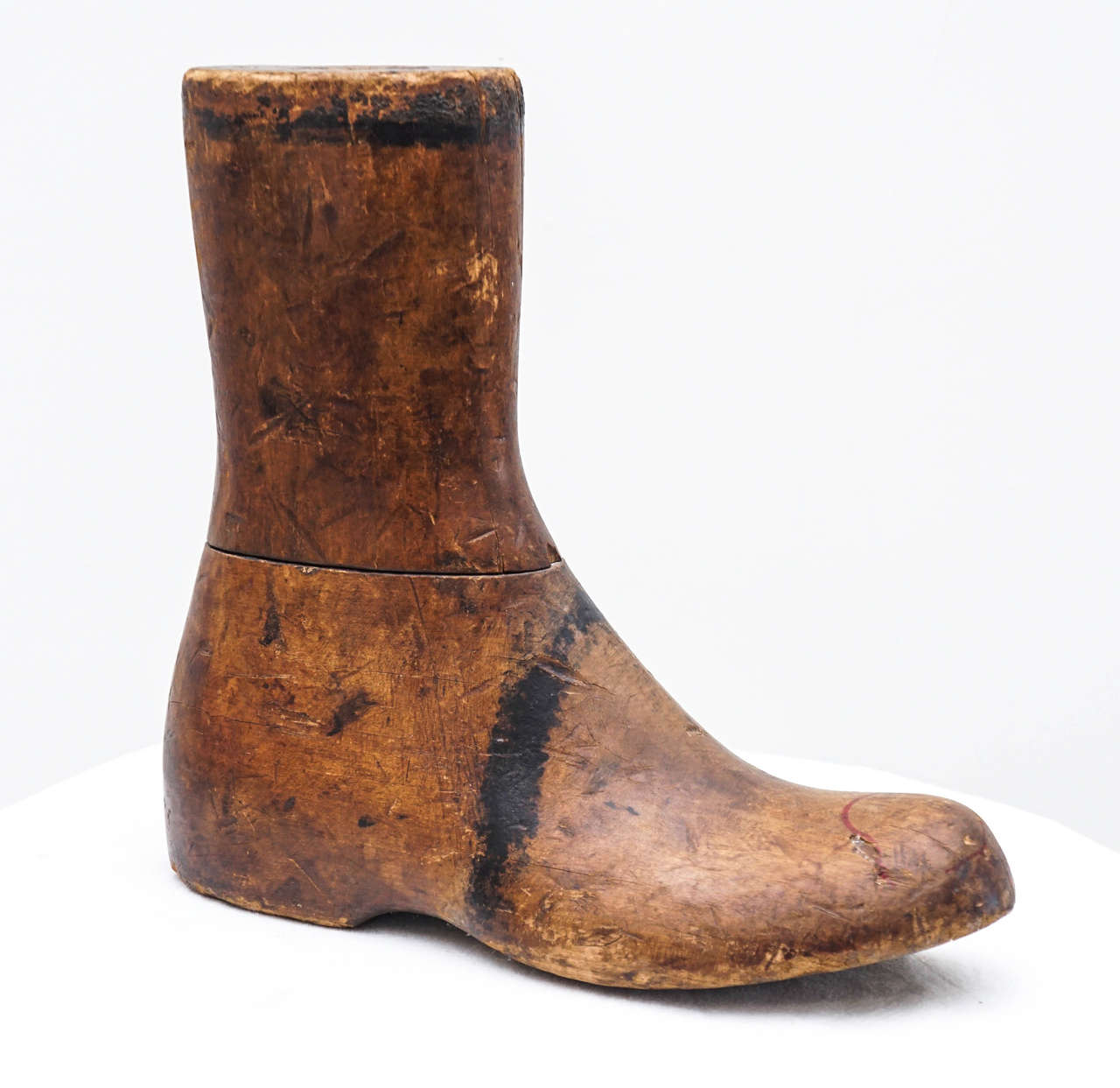 this wooden boot has very nice age to it.
its sculptural and stands solid.
a great rustic find.