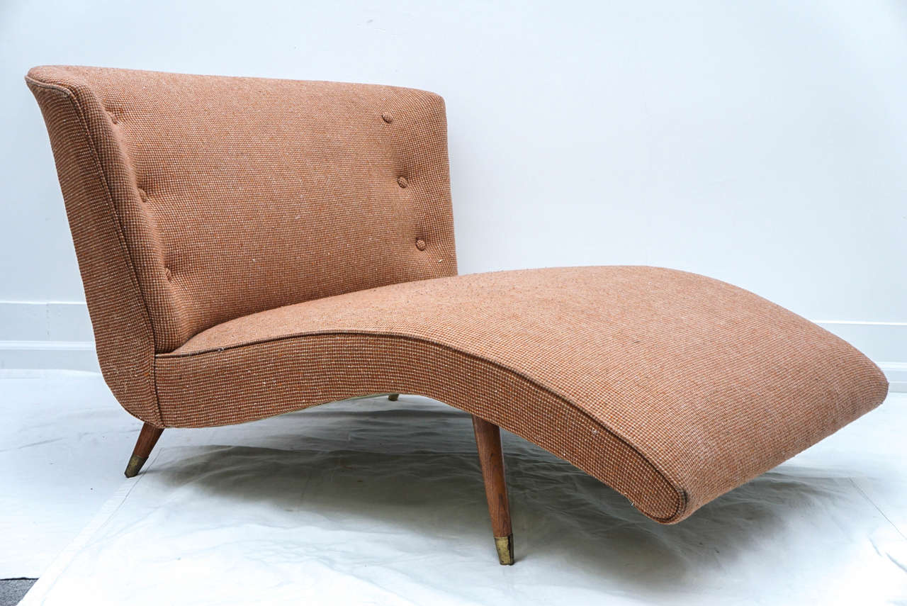 a lovely lounge chair from the 50's
it has a Paul McCobb feel to it. 
the curved back with the dowel legs give it a feminine touch.
its actually almost wide enough for two!