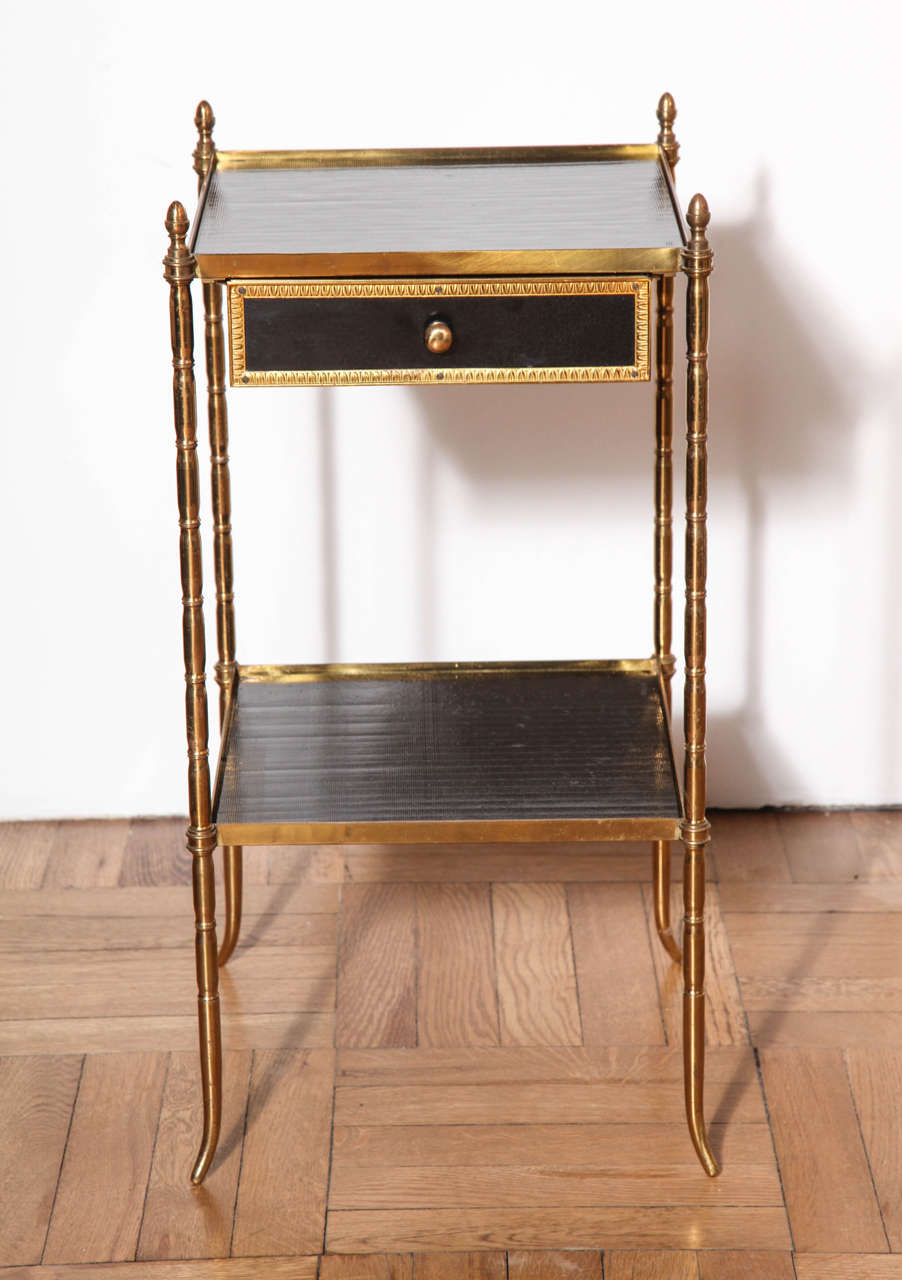 A Pair of Gilt Brass Faux Bamboo Two Tier Etagere Tables With Finely Ribbed Black Glass Insert Top and Drawer, France c. 1930
