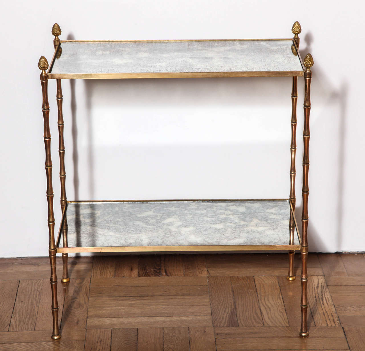 A Gilt Brass Faux Bamboo Two Tier Etagere Table with Antiqued Mirrored Glass, France c. 1950