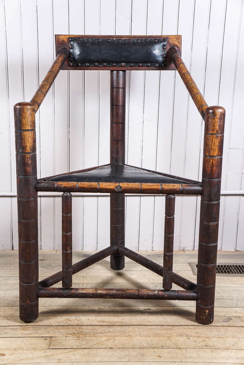 19th century copy of the 16th century English Turner chair. Oak, painted canvas seat and backrest - horsehair padding - original worn patinated surface - actually quite comfortable as well as sculptural.