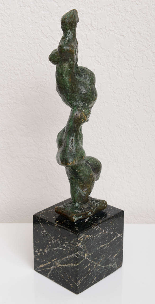 Patinated bronze male & female sculpture on a marble base by Chaim Gross (1904-1991).  Sculpture alone measures 10.25
