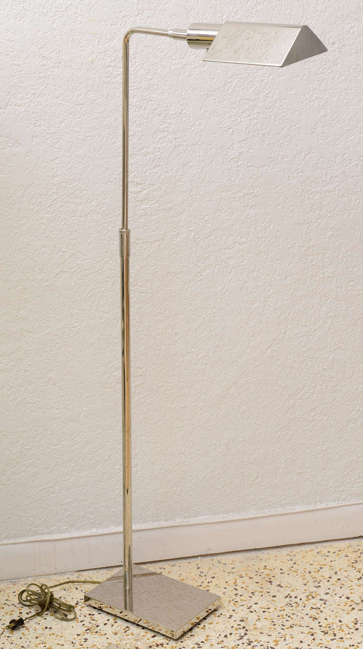 Classic Koch and Lowy chrome floor lamp, swivel top and adjustable triangular shade. 

Please feel free to contact us directly for a shipping quote or any additional information by clicking 