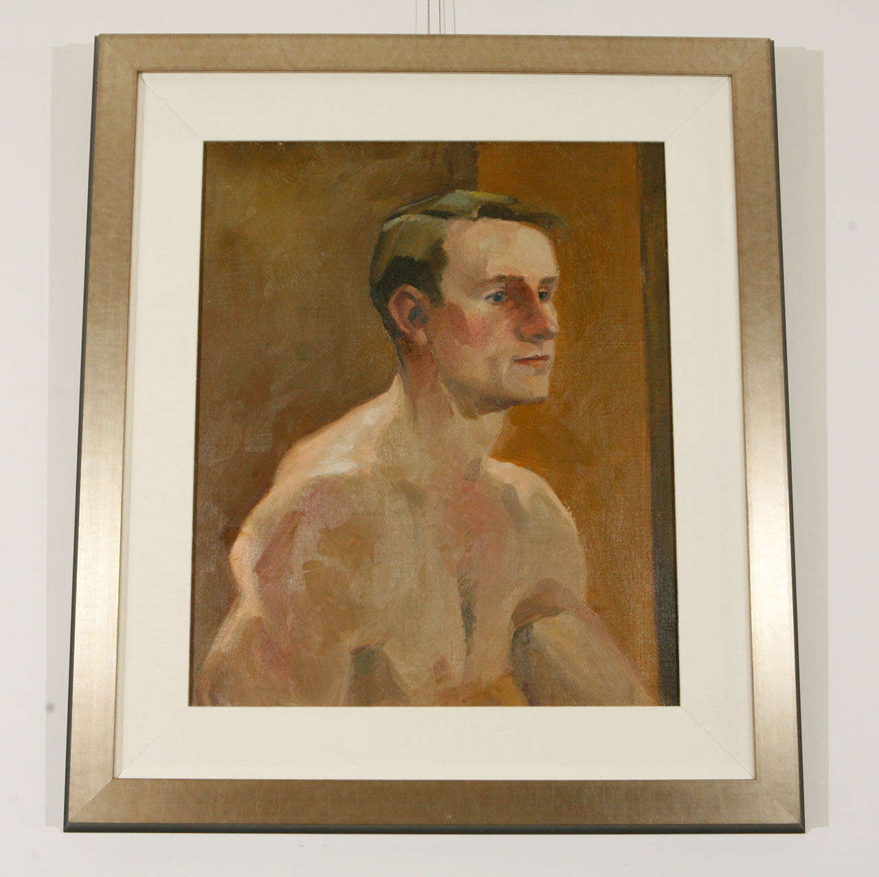 Vintage oil on canvas portrait of a man, c. 1940.  Custom matted in linen with a silver leafed frame.