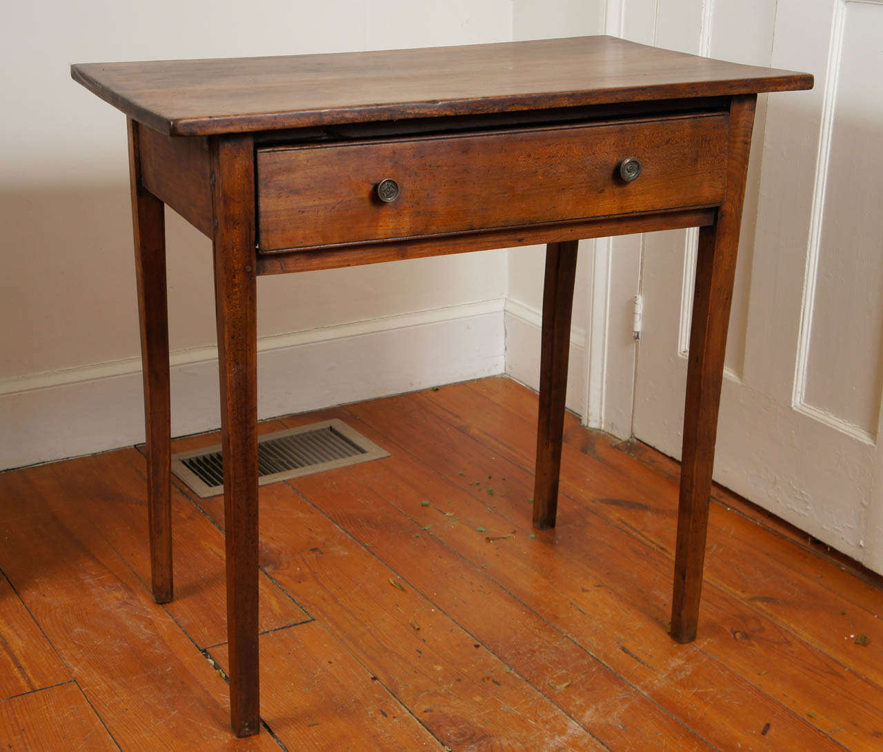 This rich fruit wood end or side table has one drawer and two original metal knobs and lovely legs. It’s the patina and size that makes this table a perfect end table in any room in the house.