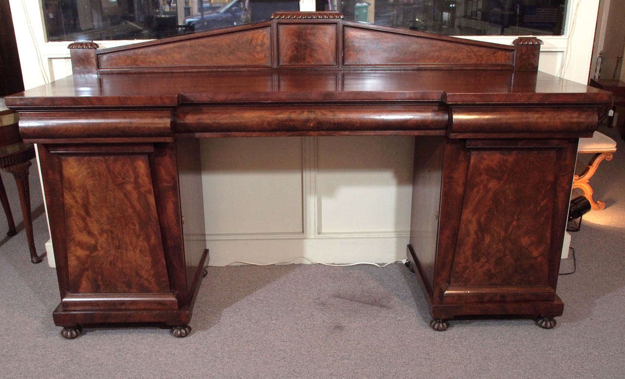 Antique English Regency mahogany sideboard with fitted drawers.