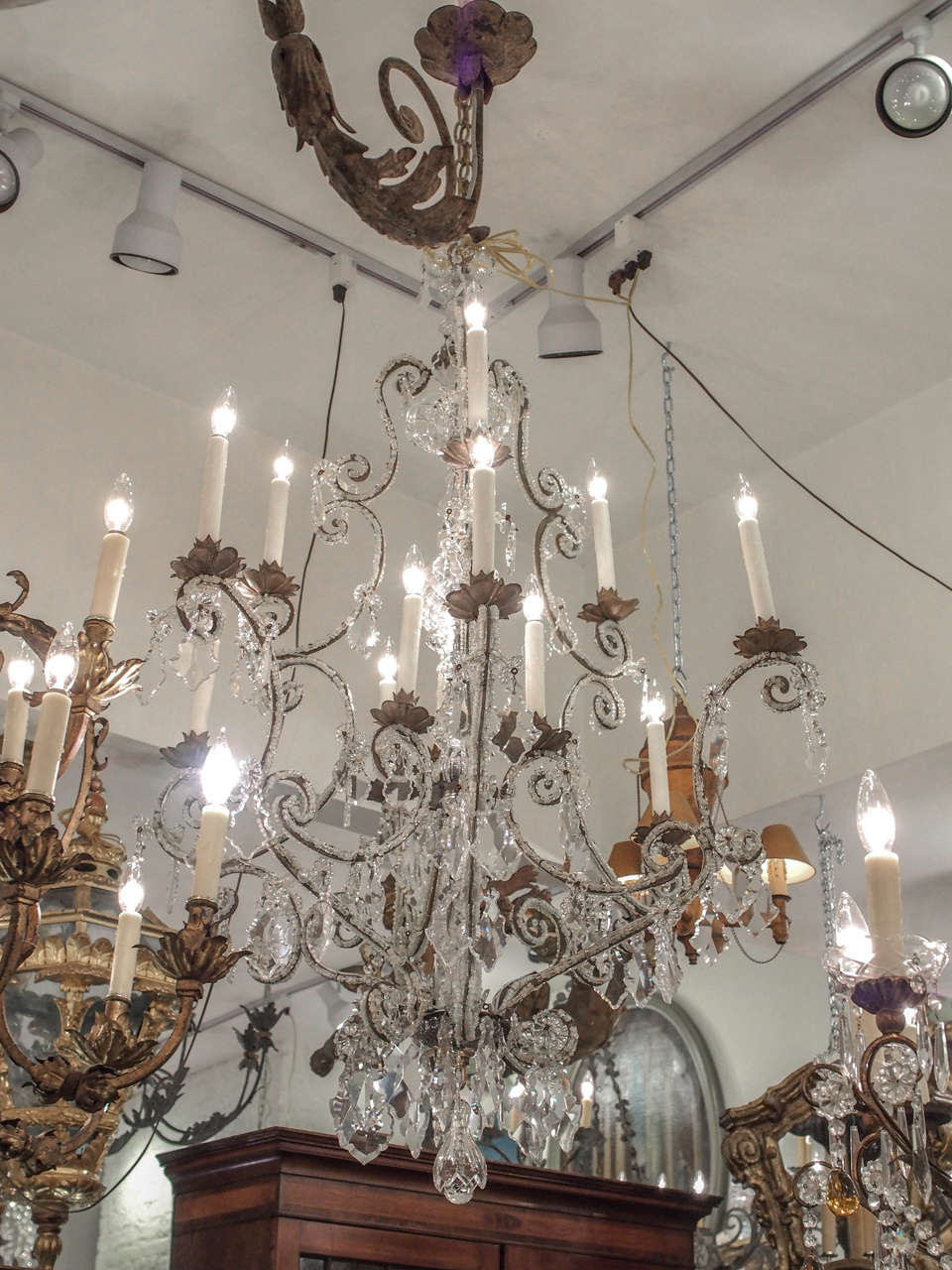 Italian, Venetian, 18th century beaded and cut crystal on an iron frame twelve-light chandelier. We have re wired this fixture and it is wired for us current rated 60 W each arm. We recommend having an electrician check it as wired can come loose in