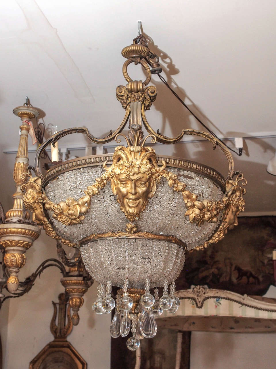 Unusual gilt bronze and crystal bead Beaux Arts light fixture with bacchus and floral garlands.