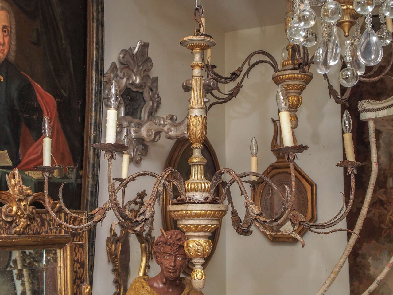 Pair of 19th century Tuscan turned stem with acanthus and ribbed detail chandelier with six iron arms. These were originally for candles and we have wired them. They are rated for 60 watt bulbs each arm. Each fixture we sell comes with chain and