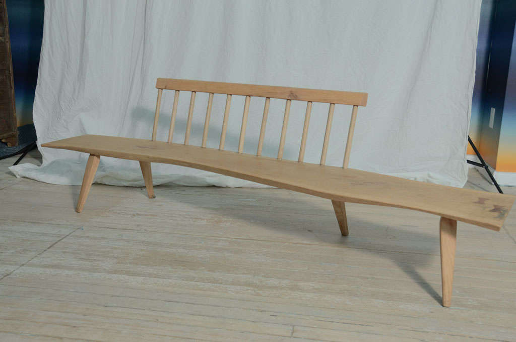 Low freeform long wooden bench.