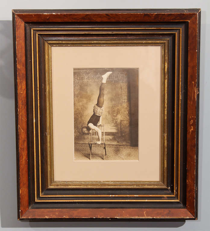 charming photo of carnival performer (?) ... crazy pants, strong and limber.  new mat, old frame